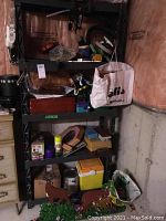 Photo of resin utility shelf with various stored household and hardware items