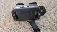 Front view of generic VR headset showing lens cover and head straps