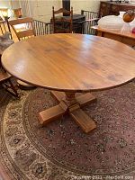 Full view of round tabletop and pedestal base
