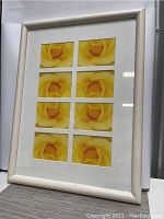 Full view of framed yellow rose collage, showing the entire piece and frame shape with visible white matte.