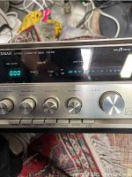 Front panel showing model and controls with digital tape counter and peak level lights.