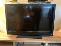 Front view of the Vizio 40-inch HDTV showing the black frame, screen, and stand base.