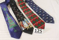 All four Christmas-themed neckties arranged side by side showing their full length and designs.