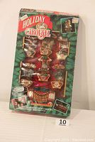 Original boxed set of Mr. Christmas Holiday Carousel showing the packaging design and contents inside the box.