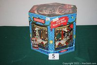 Box of the Mr. Christmas Holiday Merry-Go-Round showing packaging and product images.