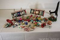 Overview photo of the entire lot showing all ornaments, boxed sets, mercury glass ornaments, berry sprigs, and bird decorations
