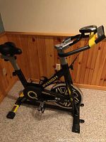 Full view of the Pyhigh S2 exercise bike showing frame, seat, and handlebars