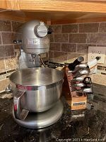 Mixer and knife block displayed on countertop