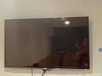 Front view of the Samsung flat panel TV, showing the full screen and bezel.