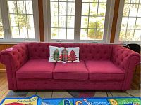 Front view of three cushion sofa with decorative pillow