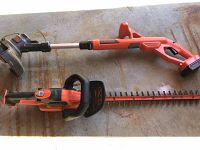 Photo showing both the Black & Decker string trimmer and hedge trimmer laid out side by side on a bench surface.