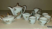Full 16 piece Fukagawa tea set featuring teapot, sugar bowl, creamer, 6 teacups, and 6 saucers.
