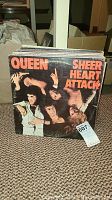 Stack of Queen albums with Sheer Heart Attack in front