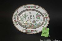 Oval porcelain serving platter with floral and botanical design in Indian Tree pattern by Coalport, shown from a top-down view with a green tag labeled 2162.