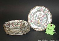 Stack of 8 scalloped edge porcelain salad plates decorated with Coalport's Indian Tree pattern.