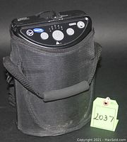 Front view of concentrator in nylon carry case with lot tag