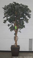 Full view of the artificial olive tree standing in a tall rectangular brown metal planter against a white background.