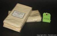 Two stacks of neatly folded cream/yellow Sonoma Hotel napkins in original packaging.