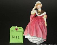 Front view of the Royal Doulton 'Sunday Morning' figurine with the green lot tag showing number 1045.