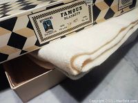 Closed box with label showing Kenwood Wool Products brand, blanket size 72x84 inches, and wool label.