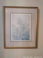 Framed floral print by Laura Lewis Lanier showing detailed flowers and ornate gold frame.