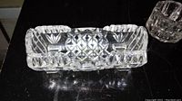 Top view of rectangular lead crystal toothpick holder showing intricate cut glass pattern and small chip on edge.