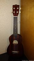 Full front view of the Makala soprano ukulele showing headstock with tuning pegs, fretboard, and body.