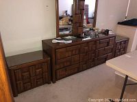 First image showing one nightstand beside matching dresser with mirror