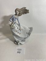 Front view of the entire figurine on a white background