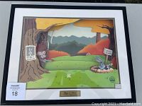 Front view of framed animation cel showing Bugs Bunny in his hole and Elmer Fudd aiming a gun from behind a tree, with colorful animated outdoor background.