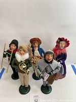Five retired Byers Choice dolls arranged together on a white background, showing full front view.