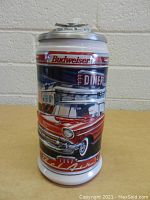 Front view of Budweiser Ceramarte collectible stein with red 1957 Chevy Bel-Air and diner scene graphic.