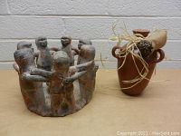 Circle of Friends pottery sculpture and decorative vase shown side by side