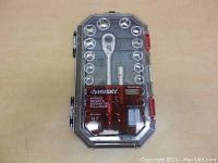 Full view of the Husky 24 Piece Socket & Ratchet Set in a closed clear plastic case with red latches, showing the ratchet handle and sockets arranged.