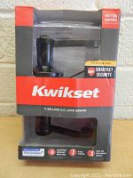Two images showing two new Kwikset lever style keyed entry door locks in original packaging. The packaging features red and black colors with the Kwikset logo and highlights SmartKey Security and Microban antimicrobial protection.