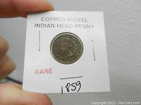 Obverse view of the 1859 Indian Head penny in a white 2x2 flip, showing the profile and date