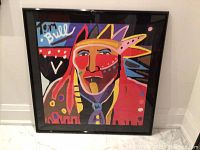 Full view of framed silkscreen print showing colorful stylized portrait and frame.