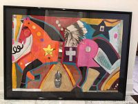 Front view of framed mixed media artwork under glass in black frame