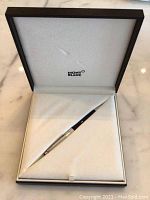 Montblanc presentation box open showing pen nestled in white velour lining