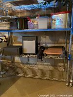Shelf with Diastar 200 slide viewer, Sawyers projector, fold-up chair and other items