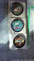 Photo of three Bradford Exchange Snowmaiden Series plates in original boxes showing detailed painted scenes.