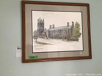 Framed print showing the entire artwork and frame hung on a wall with visible wood frame and matting.