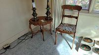 Image showing the side table with scalloped edges and curved legs, and the wooden chair with floral upholstered seat.