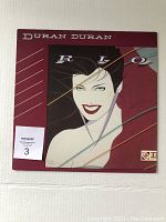 Front cover of the vinyl record showing illustrated artwork and Duran Duran logo