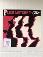 Front cover of the vinyl record album featuring stylized silhouettes and album title.