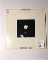 Front cover of Leonard Cohen's Songs from a Room album showing black and white photo of Leonard Cohen with artist and album title text.