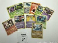 Front side showing 12 assorted Pokemon cards laid out in a spread.