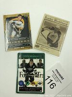 Photo showing three hockey player cards: Bobby Orr, Ryan O'Reilly, Wayne Gretzky, all sleeved and mint condition.