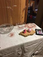 Front view showing all items on table with wood panel background.