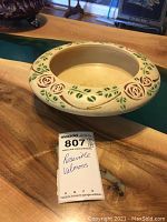 Top and side view of the Roseville Velmoss bowl showing its floral embossed design and condition.